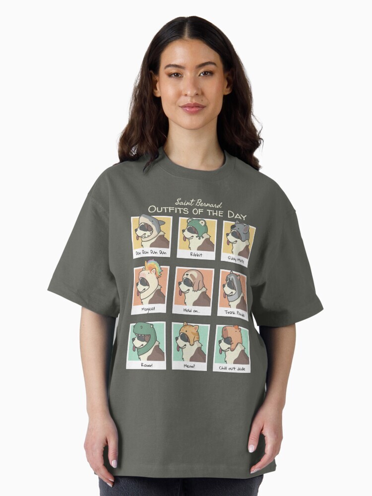 A brunette woman wearing an shirt  featuring a cartoon illustration titled “Saint Bernard Outfits of the Day” showing a cute Saint Bernard dog wearing different animal hats that include: shark, frot, koala, unicorn, sloth, raccoon, dinosaur, cat and capybara with an orange